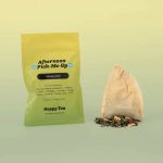 Afternoon Pick-Me-Up Tea pouch with filled tea bag and loose herbal blend.