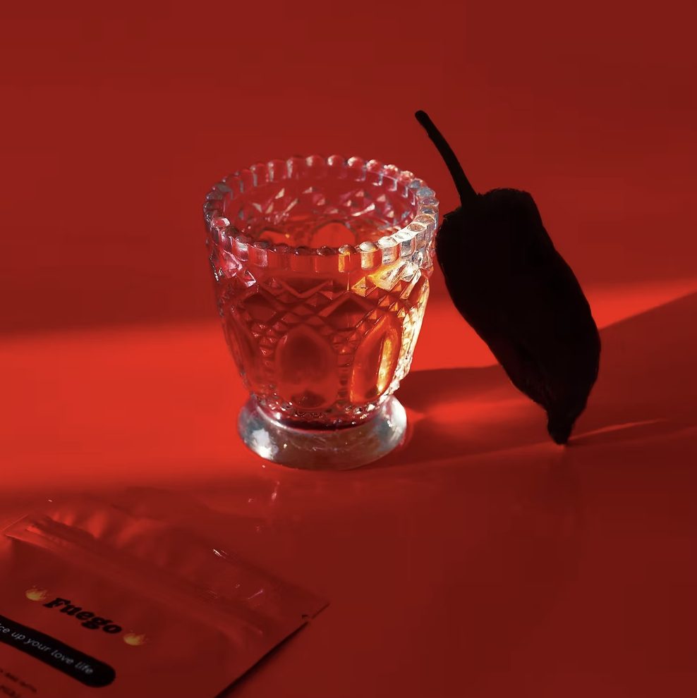 FUEGO Tea Mood Shot – Aphrodisiac Herbal Infusion FUEGO tea served in glass with chilli romantic aphrodisiac herbal tea